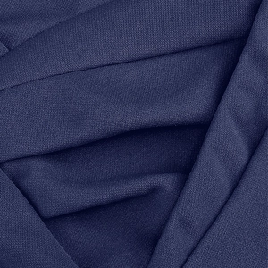 Détail macro du tissu bleu marine montrant la texture fine et le matériau tissé de qualité