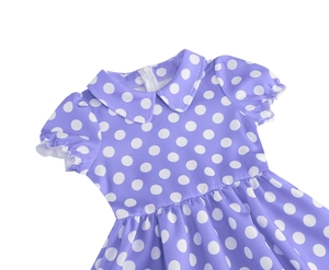 Close-up of lilac polka dot dress featuring a white Peter Pan collar and ruffled sleeves