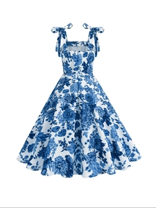 Detail view of the elegant blue floral print dress with stylish bow tie straps