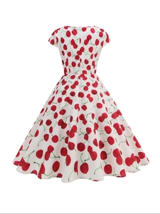 Detail view of the back of white cherry print dress showing invisible zipper and texture
