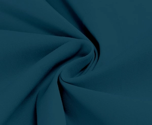 Close-up detail of dark teal fabric showing smooth texture and elegant soft draping folds