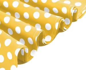 Detail of yellow polka dot dress fabric showing high-quality stitching and texture