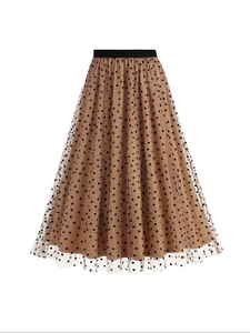 Detailed view of polka dot mesh skirt with elastic waist and layered heart patterns