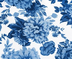 Close-up of vintage blue floral pattern on white fabric with elegant porcelain style