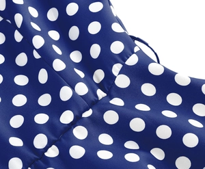 Detail of royal blue polka dot fabric with high-quality stitching on a retro dress