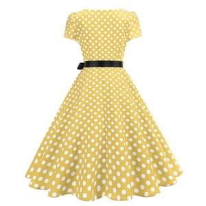Detailed back view of a yellow polka dot vintage dress with a black satin bow belt