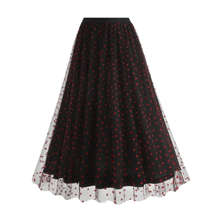 Detail of black tulle skirt featuring red heart pattern and elastic waistband for women