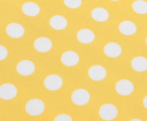 Détail macro du tissu à pois jaunes montrant la texture fine de l'armure toile