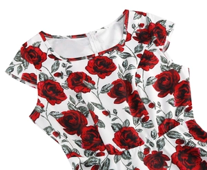 Detailed view of women's floral dress with red roses, round neck, and hidden zipper