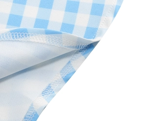 Macro view of professional overlock stitching on blue and white gingham woven fabric