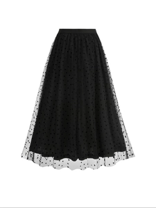 Detail of black mesh midi skirt with heart flocking and layered A-line silhouette