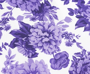 Close-up of elegant purple floral print on white vintage strap dress fabric detail