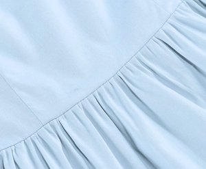 Macro detail of twill fabric texture with neat horizontal stitching and pleated design