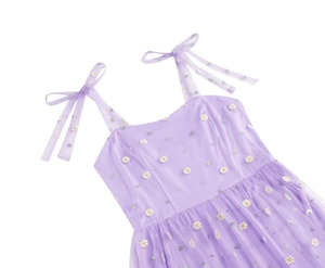 Detail of light purple mesh dress with daisy embroidery and shoulder ribbon ties