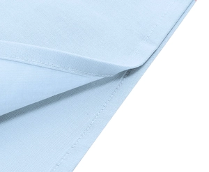 Detail view of light blue pique knit fabric with high-quality double-needle stitching hem