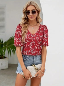 Detailed view of women's red V-neck floral blouse with puff sleeves for summer fashion