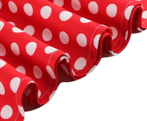 Detail of red and white polka dot dress hem with high quality stitching and soft fabric