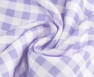 Detailed close-up of purple and white checkered fabric texture with soft glossy finish