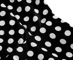 Macro détaillée du tissu à pois vintage montrant la texture fine et les coutures