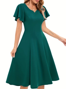 Detail view of V-neck dark green retro dress with ruffle sleeves and slim waistline