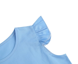 Detailed view of round neckline and elegant ruffle shoulder on light blue dress fabric
