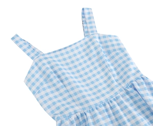 Detailed view of the blue and white gingham dress showing thin straps and square neckline