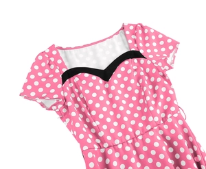 Close-up of pink polka dot dress with black V-neck trim and invisible side zipper