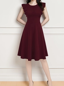 Detail of burgundy sleeveless evening dress with elegant ruffle shoulder and A-line waist