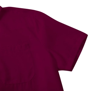 Detail of burgundy short sleeve shirt showing the pocket and high-quality fabric texture