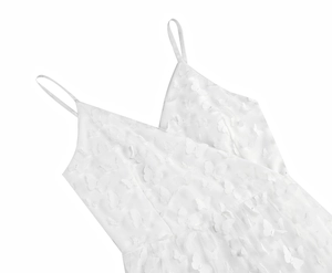 Detail of white mesh dress with 3D butterfly appliques and delicate spaghetti straps