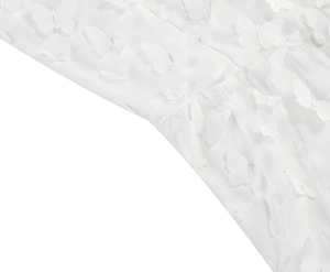 Detail of white mesh fabric with elegant 3D butterfly appliques and intricate mesh texture