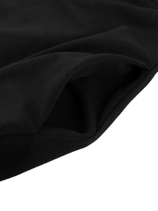 Detailed close-up showing the side seam pocket and crepe texture of this black evening dress