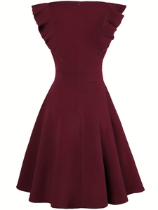 Detail of the back hidden zipper and textured burgundy fabric on an A-line evening dress