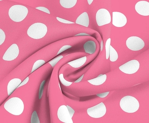 Detailed macro shot of pink and white polka dot polyester blend fabric with fine texture