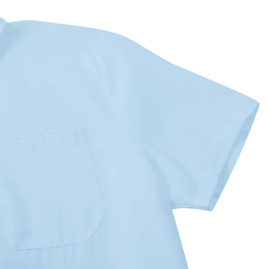 Close-up detail of light blue short sleeve shirt with shoulder seams and chest pocket