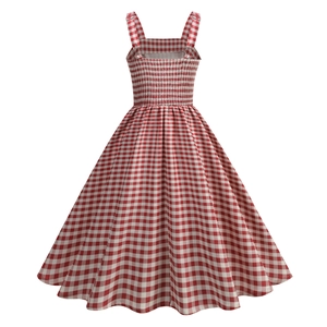 Detail view of pink and white checkered dress with smocking waist and metal ring buckles