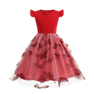 Detail of red girl dress showing intricate 3D butterfly embroidery on layered mesh skirt