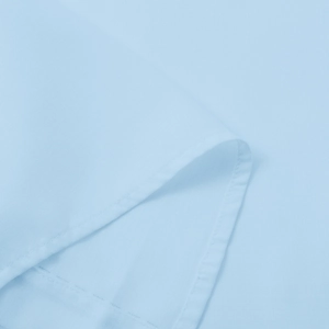 Detail shot of light blue fabric showing professional rolled hem stitching and fine texture