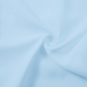Detailed macro view of light blue soft chiffon fabric texture and smooth textile drapes