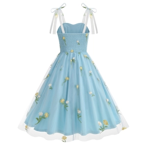 Detail of light blue mesh dress with daisy flower embroidery and ribbon bow straps