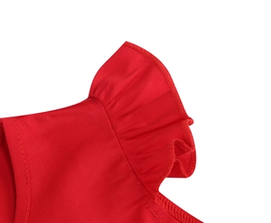 Detailed close-up of red girls dress featuring ruffled sleeves and fine stitching