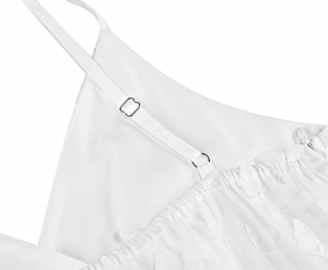 Detail of white mesh dress with 3D butterfly appliques and adjustable metal straps