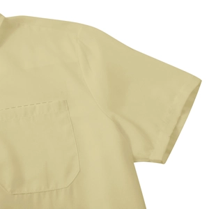 Detailed close-up of the beige short sleeve shirt featuring a neat chest pocket and seams