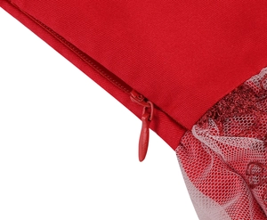 Detailed close-up of red girls dress featuring invisible zipper and lace mesh fabric texture