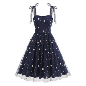 Close-up of vintage navy mesh dress featuring delicate daisy embroidery and bow straps