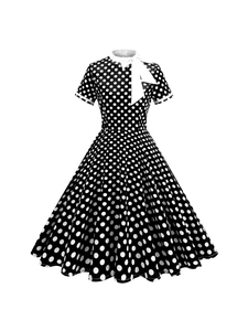 Robe vintage style Audrey Hepburn, noir à pois blancs avec un grand nœud blanc décoratif