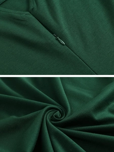 Detail of dark green dress with invisible zipper and premium knit fabric texture
