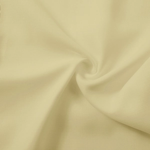 Close-up of light beige bamboo linen fabric showing fine weave texture and drape