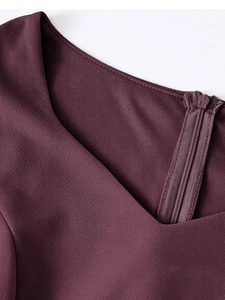 Close-up of elegant V-neckline and back hidden zipper on dark purple evening dress