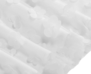 Detailed macro view of white mesh fabric with elegant 3D floral lace appliques